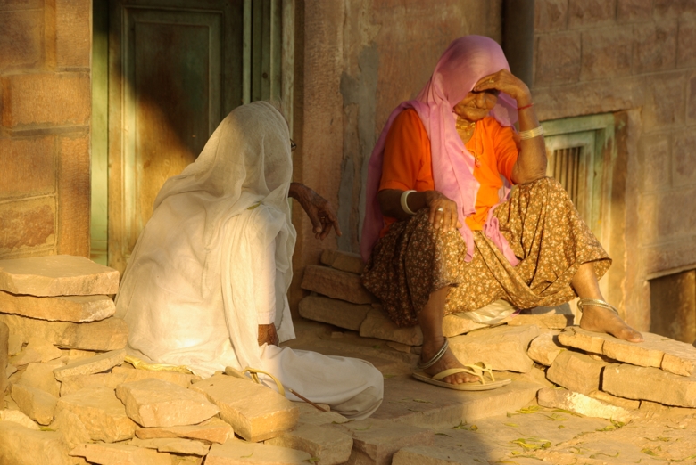 2 old women chatting on the street